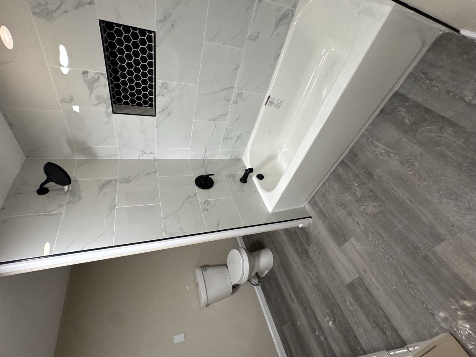Finished bathroom with black fixtures after a full refresh
