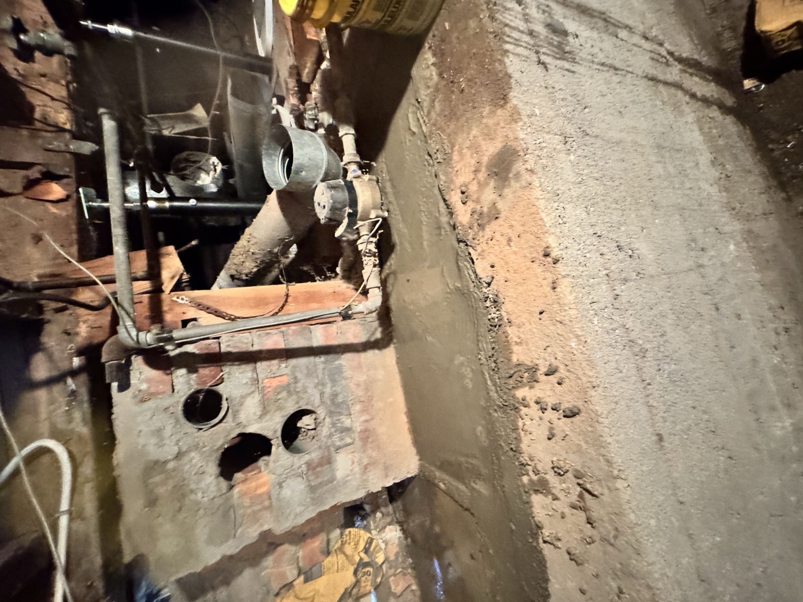 New poured-concrete foundation wall in a basement
