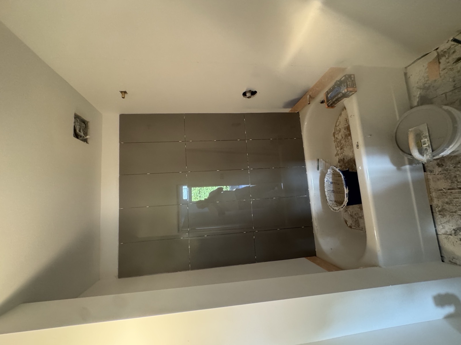 Tiled shower surround, grouted, before fixtures go in